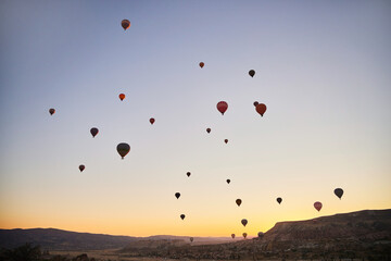 Balloons lifted into the air in Cappadocia. Entertainment and tourist attraction. A spectacular sight