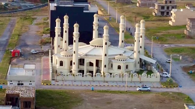 The stunning Jamia Masjid Hazrat Ali, known as the 8 Minar Mosque, standing prominently in MPCHS Multi Gardens B‑17 Islamabad.