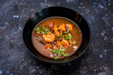 Spicy Seafood Soup with Fresh Cilantro Garnish