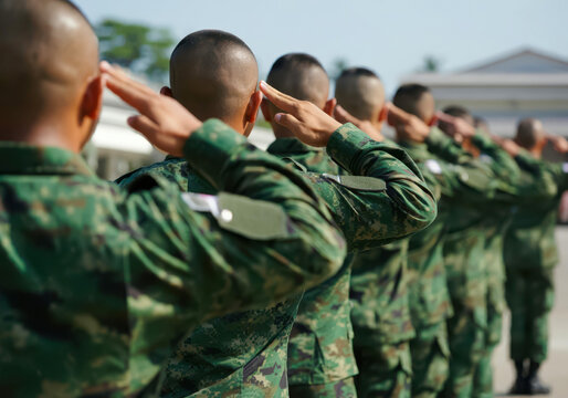 Filipino soldiers giving salute during ceremony military, glory and honor, dignified military uniform