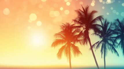 Obraz premium A vibrant sunset casts colors across a beach with palm tree silhouettes