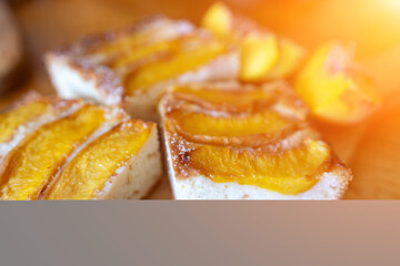 peach tart and fresh fruit closeup on wooden background horizontal view from above