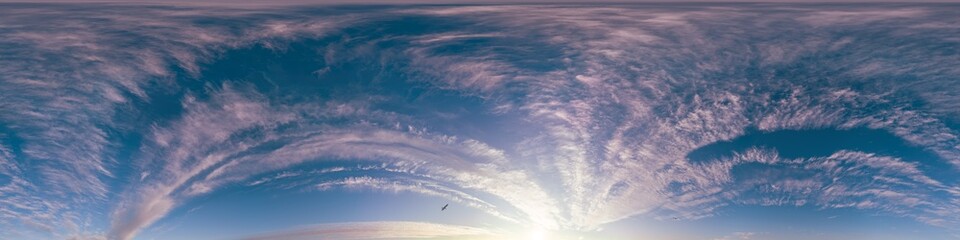 Sunset sky with bright glowing pink Cirrus clouds. Seamless spherical HDR 360 panorama. Full zenith or sky dome in 3D, sky replacement for aerial drone panoramas. Climate and weather change. © svetograph
