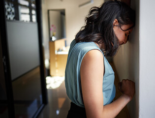 Business woman, office and crying by wall with depression, sad or bad news with grief at company....