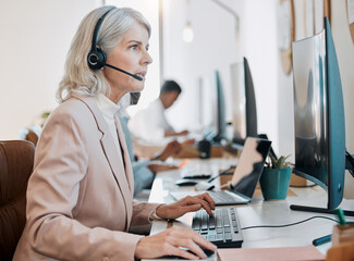 Mature woman, reading and computer at call center with talk, advice or solution with customer...