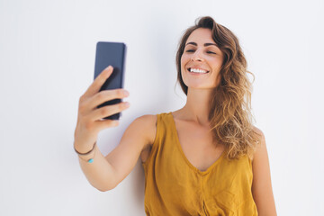 Pretty woman taking frontal selfie