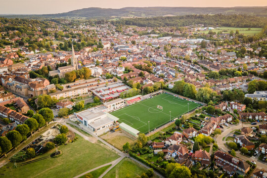 Dorking, Surrey, UK- Aerial view of Dorking Wanderers FC stadium and town centre