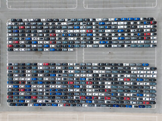 New Cars on Large Parking Lot in Port Ready for Distribution. Harbor Vehicle Storage for Shipping....