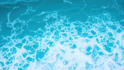 Obraz premium Turquoise ocean water with foamy waves, peaceful seascape background, water, texture, sea