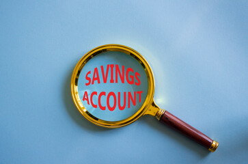 Savings Account symbol. Magnifying Glass with Concept word Savings Account. Beautiful blue...