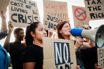 People protest for money crisis and global inflation economy, Protesters holding banners against...