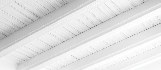 Obraz premium Close up view of a modern white wooden ceiling with parallel beams highlighting abstract patterns and bright surfaces