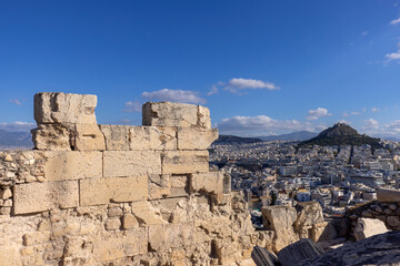 Picturesque view from Acropolis hill on Mount Lycabettus and the city skyline on a sunny day, Athens, Greece.