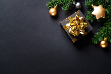Christmas background with Christmas present and golden decorations, elegant modern style.