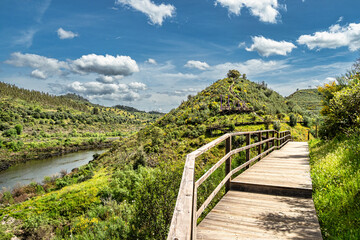 Walking along the Barca da Amieira walkways in Amieira do Tejo, Portugal.