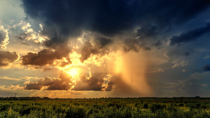 Naklejka premium Beautiful sky over a field after a summer thunderstorm.