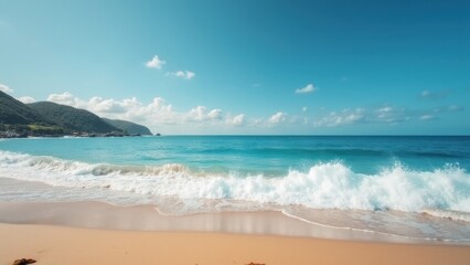The ocean shimmers vibrantly in the sunlight while soft waves rhythmically wash over the tranquil sandy shore, creating a peaceful atmosphere perfect for relaxation