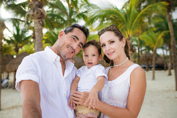 Fototapeta premium Happy family on the tropical beach. Family vacation
