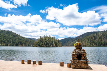 Mountain lake and Buddhist shrine in Potatson National Park, Shangri la, Yunnan, China, Asia