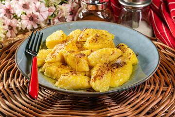 Homemade lazy noodles with cheese, crumbs and melted butter.