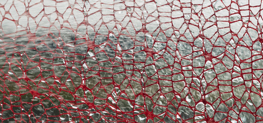A fragment of lace fabric against the background of nature