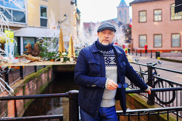 elderly man against a Christmas background Colmar France