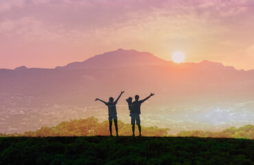 Happy family facing the sunrise looking to the future 