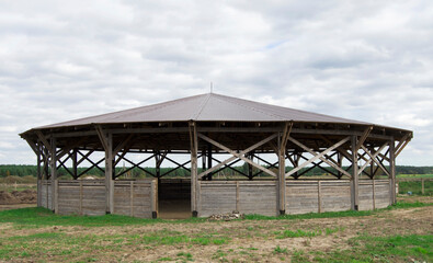 Obraz premium Indoor wood riding hall. Horse farm.