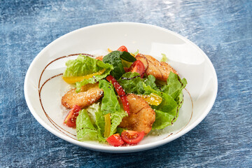 chicken nuggets with salad and sauce