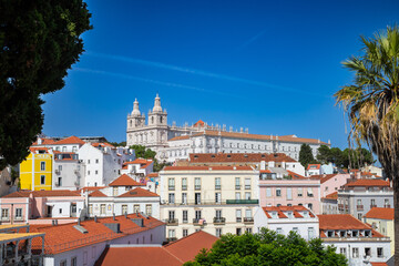 Fototapeta na wymiar Beautiful view of Lisbon city. Colorful houses and view of the city. Skyline of Alfama district, the oldest neighborhood of Lisbon in Portugal