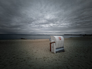 Sierksdorf beach in front of a dark cloud cover
