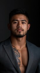 Obraz premium A confident man in a stylish outfit showcases his tattoo in a portrait