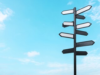 Blank Directional Signpost Against Blue Sky