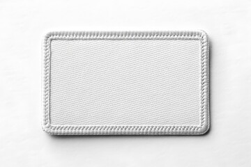 Blank rectangular fabric patch mockup with stitched border on white background, perfect for branding design.
