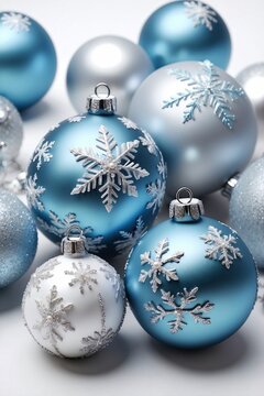 Light Blue and Silver Christmas Ornaments and Snowflakes on a Pure White Background