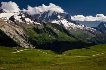 Alpine landscape in Switzerland, Alps mountains, green meadows