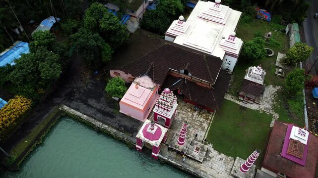 Shree Rameshwar Mandir, Chaul surrounded by greenery in Revdanda, India with waterfront