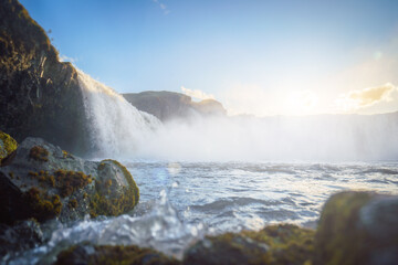 Majestic Goðafoss waterfall at sunset, with cascading waters of the Skjálfandafljót River, in northern Iceland.