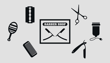 Set of black silhouettes of barber tools. Vector on a gray background