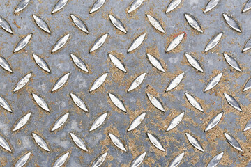 Metal texture with steel plate pattern. Rusty diamond plate surface. Rough grunge industrial iron Dirty metallic texture.