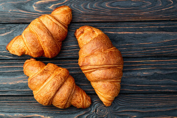 Group of sweet croissant . French morning breakfast . Top view