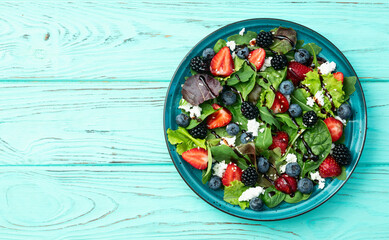 Berries salad (blueberry strawberry blackberry ) with cheese feta and balsamic sauce