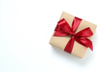 Beautiful gift box tied with bow on white background 