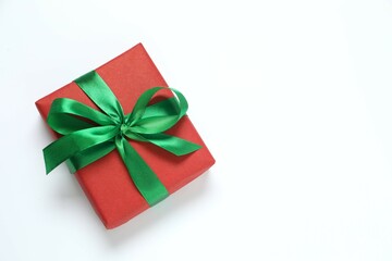 Beautiful gift box tied with bow on white background 