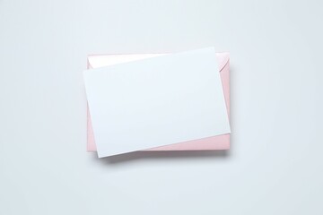 Pink envelope with paper card on white background