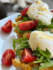 food, boiled poached egg, arugula, tomatoes