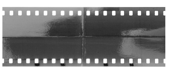 blank film negative strip with a white border and a black center with four vertical rows of holes...