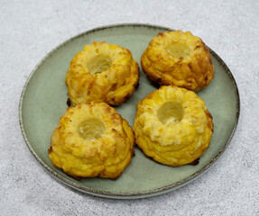 Closeup view of fish and pumpkin muffins in a dish on the white table