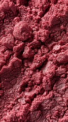 A vibrant close-up of reddish crushed mineral powder showcasing its fine texture and intricacies highlighting the natural beauty of mineral pigments