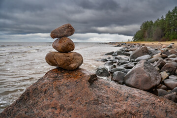 Zen concept. The object of the stones on the beach at sunset. Relax & Meditation.